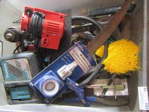 lot 75 image: Various hand saws - wire brushes- Makita battery charger and more