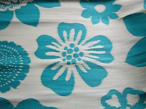 lot 136 image: Patio wicker style rug 7ft5ft