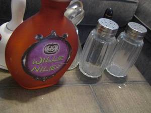 lot 248 image: 5 small glass hand bells, set of salt and pepper shakers, plastic small creamer cup, Willie Niles glass bottle