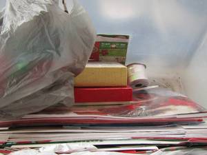 lot 273 image: tote of Christmas boxes new and used, bow and bell tree ornaments