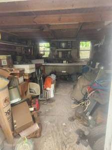 lot 227 image: Contents of lower half of shed in backyard - DOES NOT INCLUDE VICE ATTACHED TO WORKBENCH OR PUSHMOWER