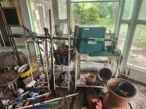 lot 209 image: Selection of garden tools and wrought iron shelfs and tool holder