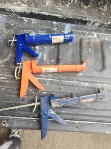 lot 173 image: Selection of caulk guns and a few tools