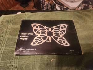 lot 142 image: The Butterfly - silver plated trivet