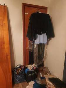 lot 123 image: Selection of clothing and material