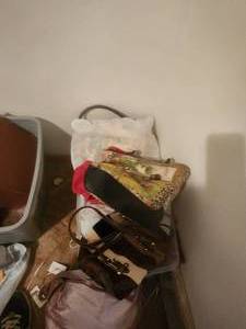 lot 112 image: Bin of purses
