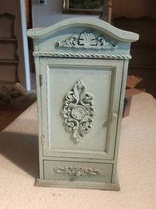 lot 52 image: Small wood countertop cabinet with contents
