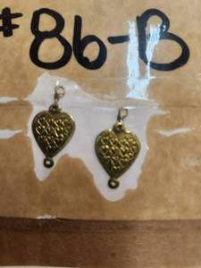 lot 190 image: Generous selection of metal pendants and charms for jewelry and craft making