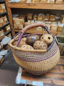 lot 396 image: Woven basket full of spheres