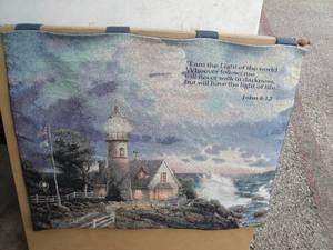 lot 33 image: Thomas Kinkade Lighthouse And John 812 Scripture- Wall Tapestry With Wooden Hanging Rod. About 32 x 27