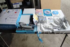 lot 4 image: 2-Wii Gaming Systems With Games, Controllers, Sports Pack, Controllers and More. Untested