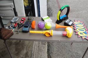 lot 91 image: Mixed Lot Of Toys And Games Including Simon, 2-Little Tykes, POW Metal Sign And More.