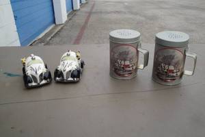 lot 114 image: 2-Sets Of Salt And Pepper Shakers, Emergency 911 Police Cars and Currier And Ives Range Top Styles