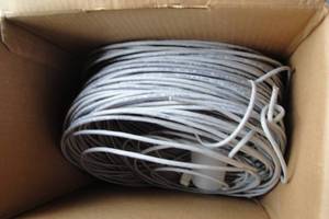 lot 145 image: Roll Of Cat 5e Cable, 4-Pair Gray Communication Cable- Unknown Footage.