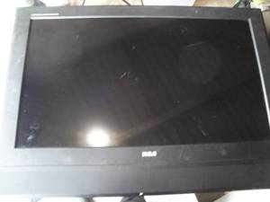 lot 224 image: RCA  32 Digital Flat Screen TV With Remote And Power Cord, Model J32H700. Note Powers On But Can Not Change Channel 