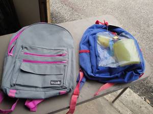 lot 242 image: Lot Of 2-Kids Backpacks, 1-Full Of Sand Box  Beach Stuff
