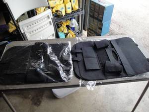 lot 250 image: 2-Over The Car Seat Items Holders, Black Felt Like Material, Pockets and Slots, About 22 x16