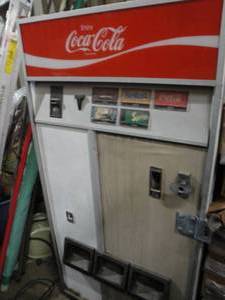 lot 1 image: Cavalier Coke Machine, Can Or Bottle With Keys-Lights Up and Get Cold...NOTE BRING HELP AND EXTRA HELP..VERY HEAVY