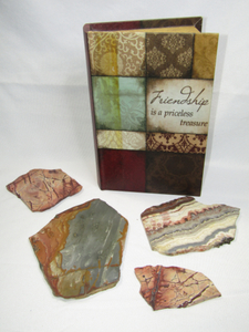 lot 279 image: Sliced stone slabs and hide a book