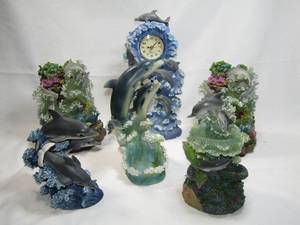 lot 292 image: Dolphin theme clock and dolphin figures