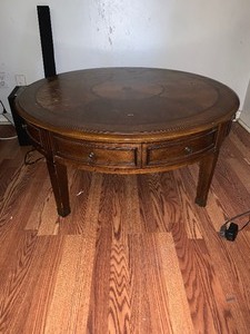 lot 7 image: Round coffee table with drawers