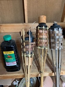 lot 134 image: Tiki torches and partial fuel   see pics