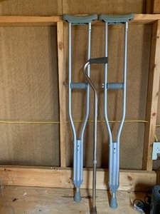 lot 136 image: Aluminum crutches and cane    see pics