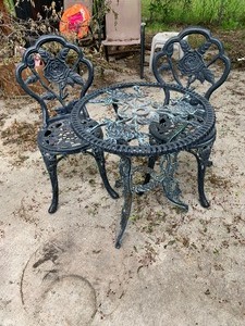 lot 163 image: Cast iron outdoor patio 2 chairs and table - table needs glass top - as shown