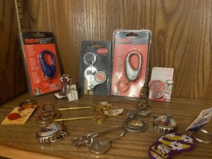 lot 20 image: Generous amount of assorted key chains in oval wicker basket