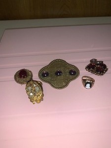 lot 39 image: Vintage jewelry-German broach with res stone. Victorian locket with seed pearl, an old pin from England