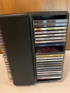 lot 52 image: CD carousel holder with generous amount of CDs - various artists
