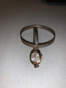 lot 94 image: Benrus ladies vintage watch diamond and ruby gold tone & sterling stamped 921 dangle vintage bracelet