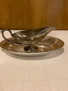 lot 140 image: Silver colored serving tray and gravy boat stamped 905 on bottom