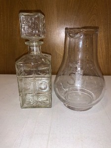 lot 141 image: Heavy glass decanter and pouring pitcher with etched S insignia