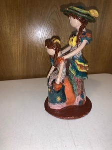 lot 44 image: Lime faceless doll