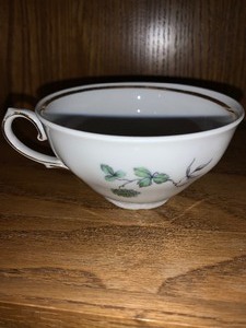 lot 180 image: 2 pieces - Winterling Bavarian gold trimmed cup (Made in Germany) and Ceramic votive candle holder hand painted made in USA