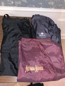lot 216 image: 3 clothes cover bags - 1 Neiman Marcus - 1 Samsonite - 1 unmarked - good shape