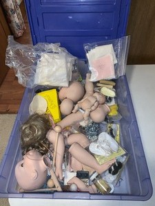 lot 230 image: Plastic tote with miscellaneous crafting parts for making dolls