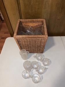 lot 264 image: Wicker basket with generous portion and variety of plastic cups and a few plastic saucers as shown