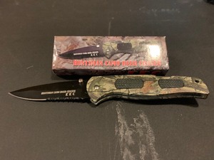 lot 271 image: NIB Huntsman Camo Deer Chaser lock blade with belt clip