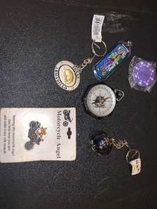 lot 283 image: Compass, misc. keychains, and motorcycle angel lapel pin - see pics