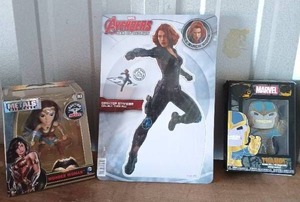 lot 13 image: Wonder Woman Die Cast Figure, Black Widow Desk Top Standee and Thanos Enamel Pin All brand new