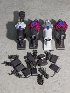 lot 190 image: Lot of 4 - Dyson Cordless Vacuum Motors Only w Chargers