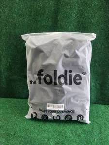 lot 89 image: Foldie black travel bag with tags