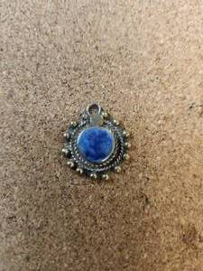 lot 115 image: Generous selection of metal pendants and charms for jewelry and craft making