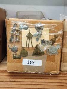 lot 268 image: Generous selection of metal pendants and charms for jewelry and craft making
