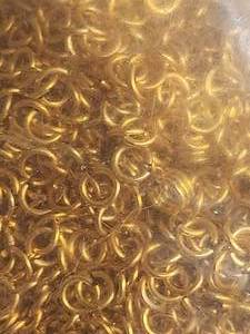lot 416 image: Generous selection of gold circular links for jewelry making - 3 bags