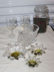 lot 22 image: Glassweare items, Two Wine Glasses, Santa Sleigh and Poinsetta Dishes, Glass Square Canister full of Red and Green Glass Marbles