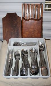 lot 59 image: Set of Misc Silverware, 2 Silverplate Spoons Cutting Board and Set of Black Knives
