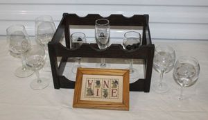 lot 62 image: Handmade wooden Wine Bottle Rack, Glass stemware and Beautiful Framed Cross Stitch